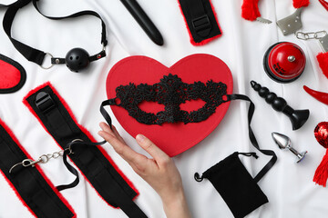 A collection of sex toys on a light background.