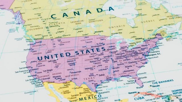 Close-up of the country word United States on a world map with the detailed name of the capital city. Camera zoom out.