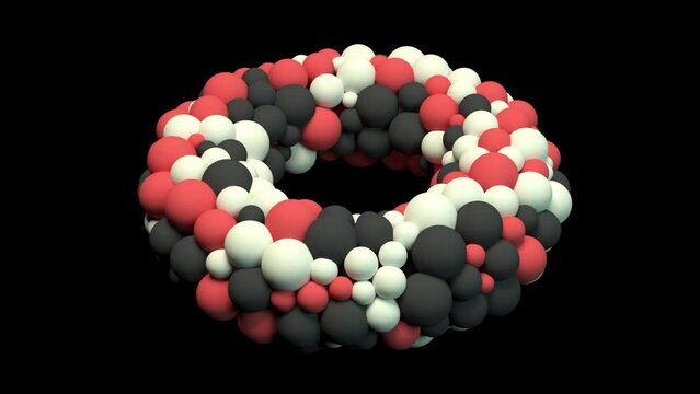Three-dimensional torus consisting of colored rotating spheres breaks up into individual particles that fly upward. Abstract animation: movement of colorful liquid particles on black background
