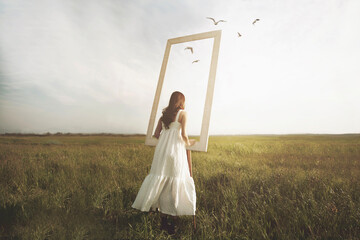 woman looks out of a surreal window that looks towards the infinite; concept of freedom