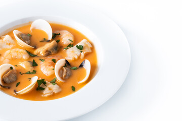 Seafood soup on a plate isolated on white background. Copy space