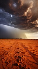 A dramatic storm rolling in over a barren desert landscape