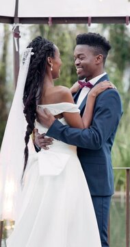 Outdoor, dance and black couple with marriage, wedding and happiness with commitment, event and celebration. African man, woman and embrace outside, love or happy bride with groom, moving and smile
