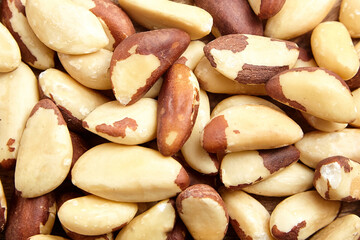 Brazil nuts background closeup. Shelled brazil nuts, top view