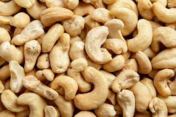 Cashew nut heap food texture background. Organic cashews, top view