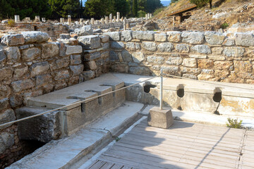 Public toilets used during the Roman period in the open air museum of Turkey, Izmir, Ephesus.
