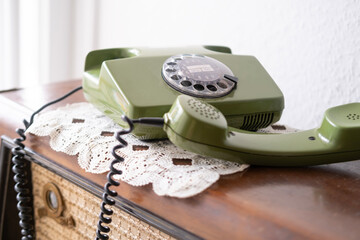 Old green Rotary Telephone with Disc Dial, Dialing on retro phone reciver down, Connecting with...