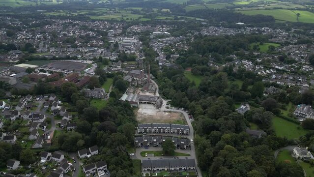 Ivybridge, Devon, England: DRONE VIEW: The town of Ivybridge: Stowford Paper Mill; Ivybridge Community College & Brunel's Viaduct Bridge. Ivybridge is a commuter town on the edge of Dartmoor (Clip 2).