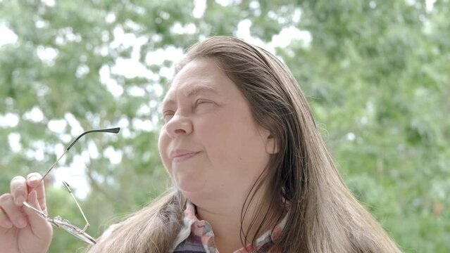 pretty woman 40-45 years old with closed eyes, fatigue syndrome eye Asthenopia, eye pain symptoms, including strain, allergies, infections and injuries, sharp, dull, throbbing or burning sensations
