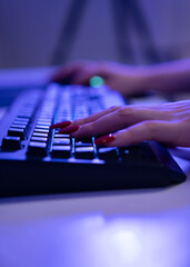 Close-up hand on a computer keyboard. pro gamer team 