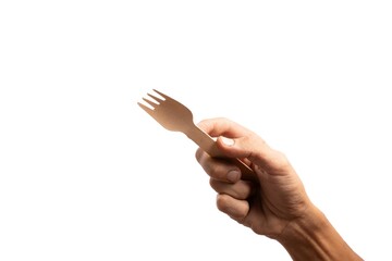 Black male hand holding a disposable wooden fork isolated no background