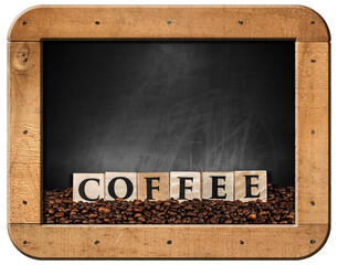 Heap of roasted coffee beans and the text Coffee made of wooden blocks, on an empty blackboard with wooden frame and copy space. Isolated on white or transparent background. Png.