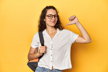 Caucasian university student with glasses, backpack, feels proud and self confident, example to...
