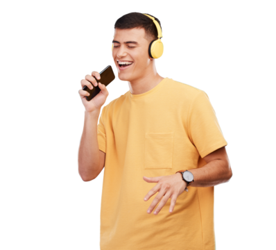 Happy man, headphones and karaoke with phone in studio for music, radio or audio with smile on transparent png background. Listen, smartphone and person with digital media streaming and singing song