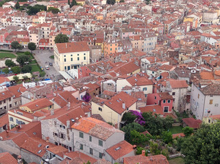 Fototapeta premium arial view of Rovinj old town seen from the tower of Church of Saint Euphemia at sunset 