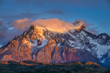 Beautiful mountain view of Paine Grande during sunrise and sunlight shines at mountain peak with...