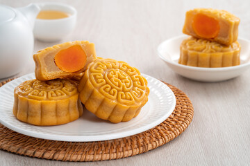 Delicious Cantonese moon cake for Mid-Autumn Festival food mooncake on wooden table background.