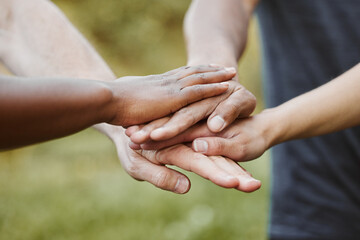 Hands together, closeup and support with team of people outdoor, help and mission with strategy....