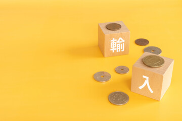 輸入と書かれたブロックとお金