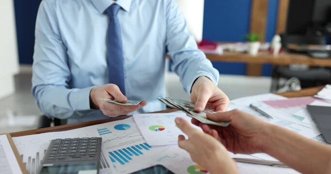 Businessman transfers half of funds to partner. Profitable financial deal and handshake concept