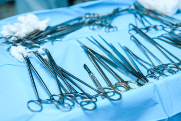 Medical instruments lie on the operating table for surgeons in the hospital