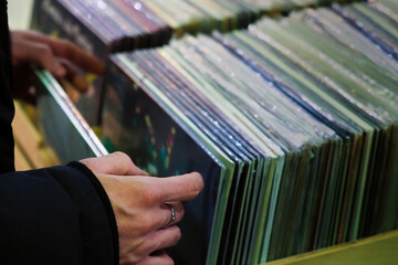 Man chooses a record in a vintage vinyl store - 650661016