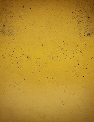 Yellow concrete wall with black paint splatter