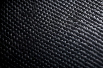 A Captivating Closeup View of the Exquisite Carbon Fiber Material: Intricate Patterns and Textures Revealed in this Closeup Shot, Showcasing the Details of this Certain Material.