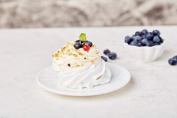 Aesthetic Pavlova Dessert with blueberry. Cozy home table setting