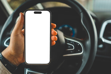 A phone with an isolated screen in the hands of a woman in a car