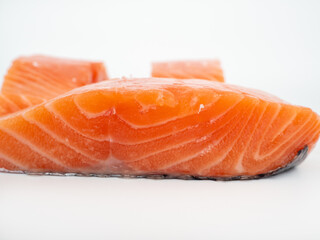 Salmon fish fillet on a white background. Red fish fillet close-up.