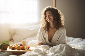 Zelfklevend Fotobehang Happy Young woman eating breakfast in bed © wolfhound911