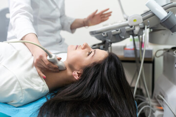 Qualified medical specialist using ultrasound equipment in the clinic