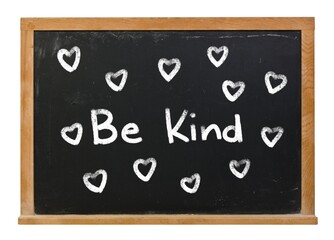 Be Kind surrounded with hand drawn hearts written in white chalk on a black chalkboard isolated on white