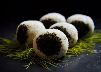 rice balls with fillings, wrapped in seaweed, showcasing the contrast of the creamy white rice against the dark, glossy seaweed
