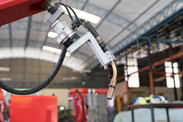 Robotic arm at production line in factory industrial. Automatic robot arm system welding machine in the industry factory. Industrial robot manufacturing technology