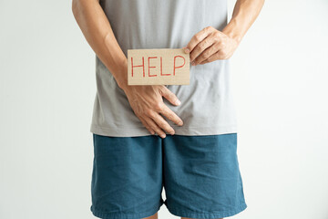 Man hold hand in front of private parts feeling discomfort from disease and inflammation. Venereal,...