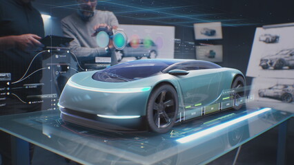 Two male automotive designers create design of eco-friendly electric car, choose color using tablet...
