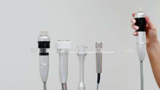 Close-up Medical device for radiofrequency lifting procedure. Face skin rejuvenation and anti-age at aesthetic cosmetology center. RF lifting in beauty clinic.