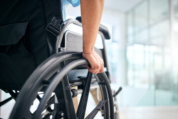 Hand, rehabilitation and person in a wheelchair at a hospital for medical support, transportation...