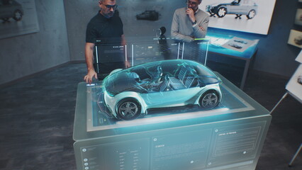 Two automotive engineers develop body of new eco-friendly electric car using futuristic augmented...