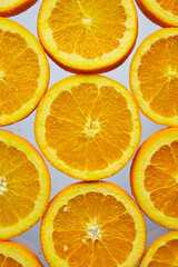 Close up of orange slices on white background