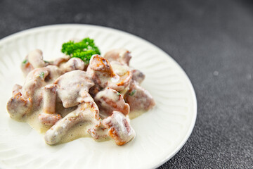 chanterelle julienne mushroom cream sauce appetizer meal food snack on the table copy space food background rustic top view 