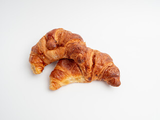Croissant on a white background. Baked goods croissant close-up.