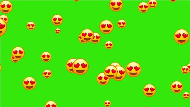 Emoji with heart shaped eyes. In love emoticon, yellow face with heart-eyes and open smile. Animated falling emojis. Social media icons symbol animation with green screen background.