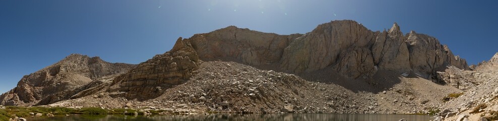Panorama shot of huge white granite rocks over Scout Boys lake under top White Mountain, usa