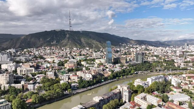 Tbilisi, Georgia - July 13 2023: Flying over Shota Rustaveli avenue in the center of city. Aerial view of The Biltmore Tbilisi Hotel