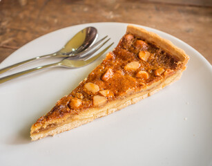 macadamia pie on a white round dish