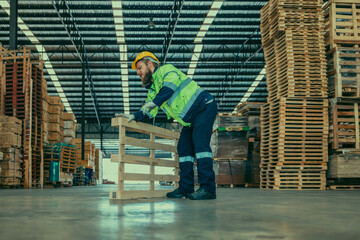 A wood factory worker's muscle injury from lifting heavy workpieces, worsened by slippery floors.