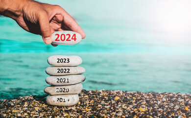 Happy new year 2023 replace old 2022. New Year 2023 is coming concept idea on beach. Creative photo...